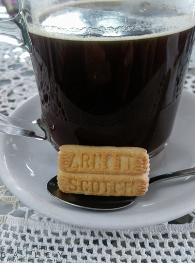 Coffee and small biscuit